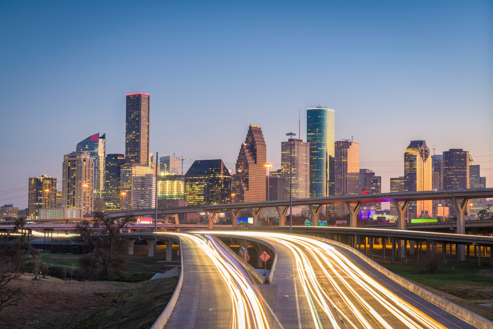 houston skyline at dusk with cars with texas insurance