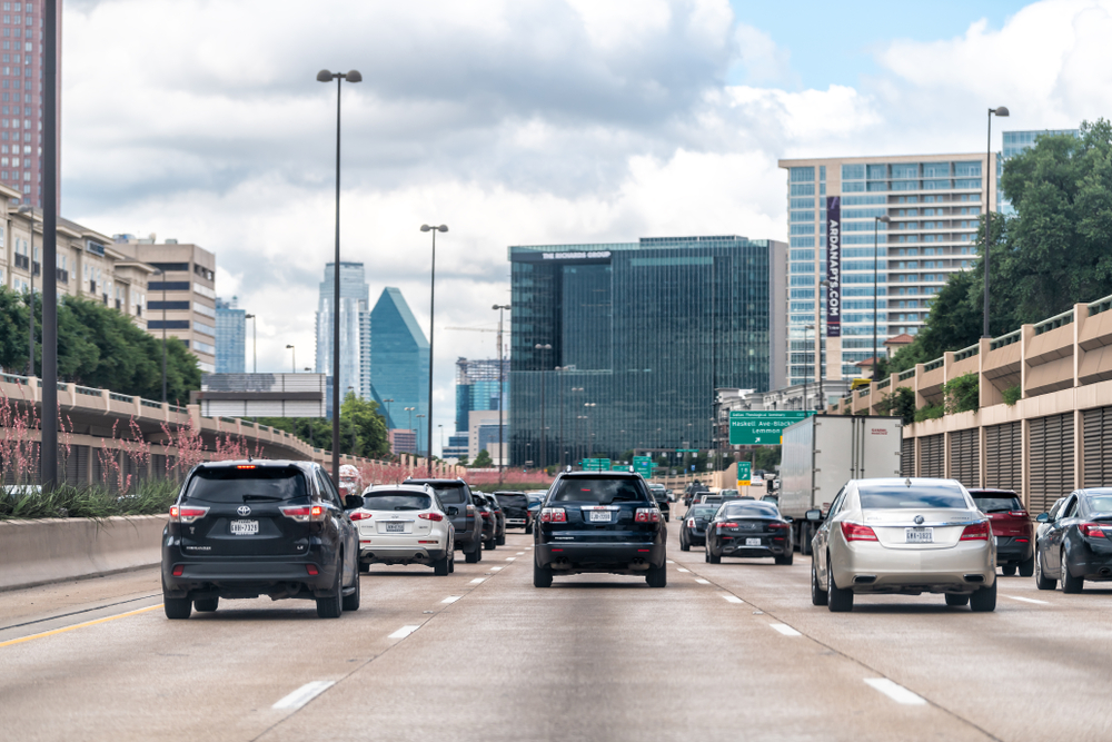 dallas skyline and highway with cars on it