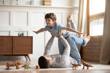 young father and son playing